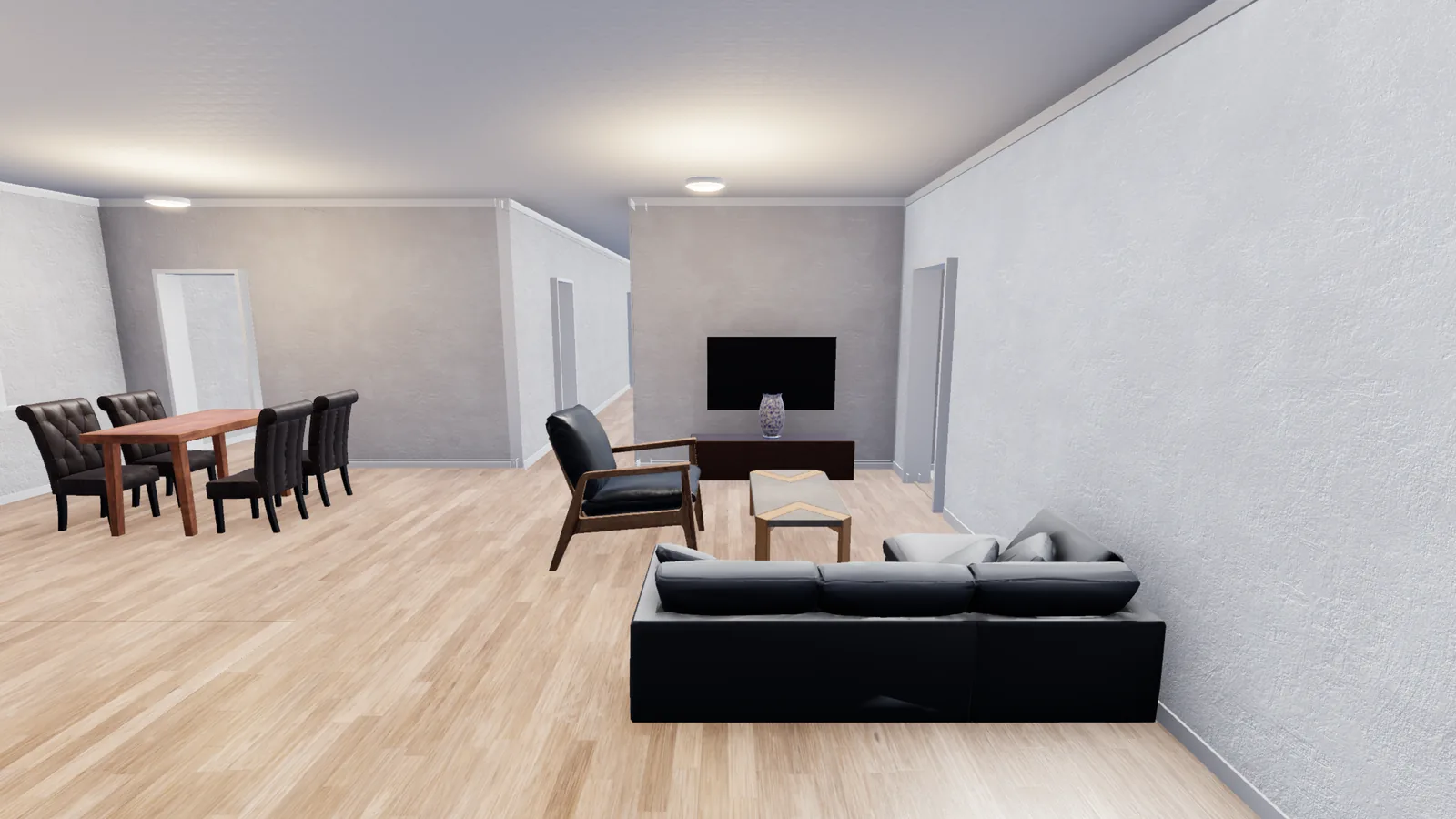 The Legacy great room — warm white walls, warm oak floor